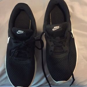 Worn Nike tennis shoes.